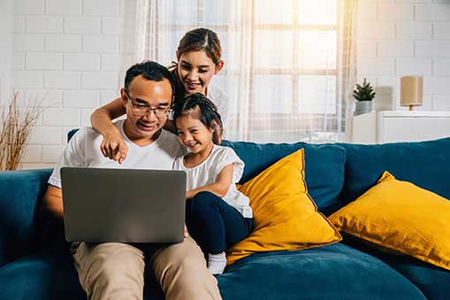 dad and kids sitting on the couch